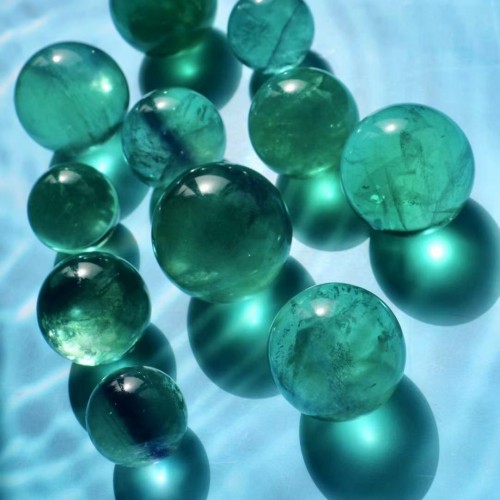 green fluorite crystal spheres with rainbow