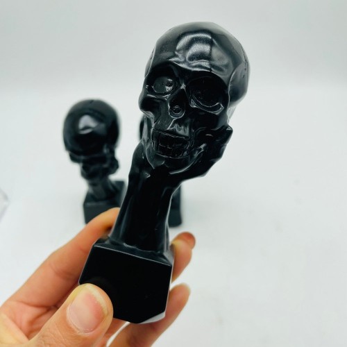 Black Obsidian Hand Holding Skull Carving Wholesale